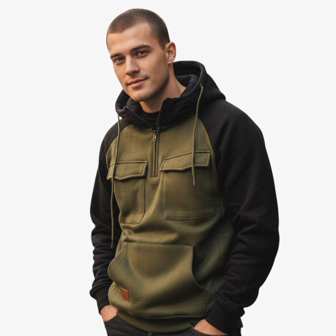 Man wearing a black and green hoodie on a white background