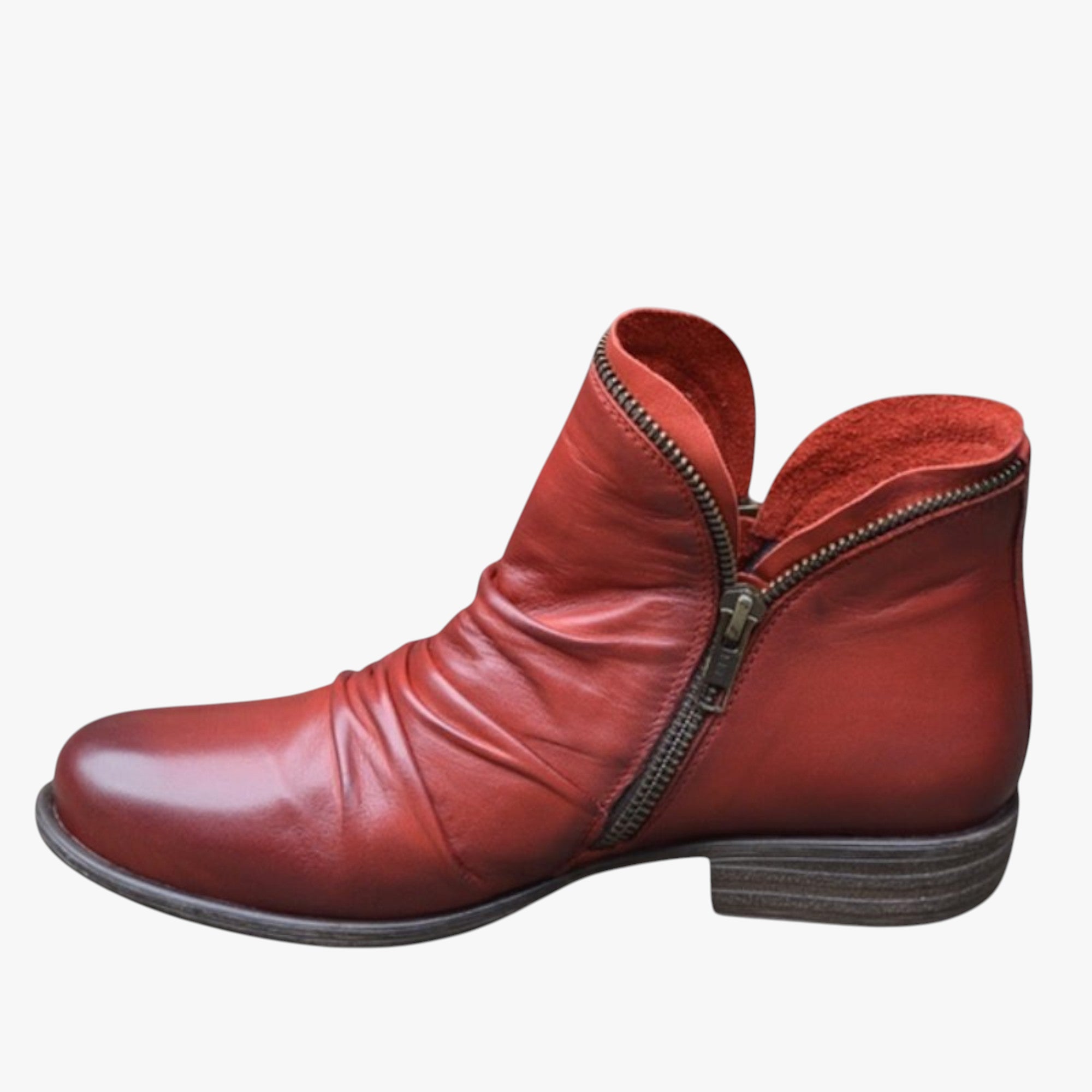 Red leather ankle boot with zipper on a white background