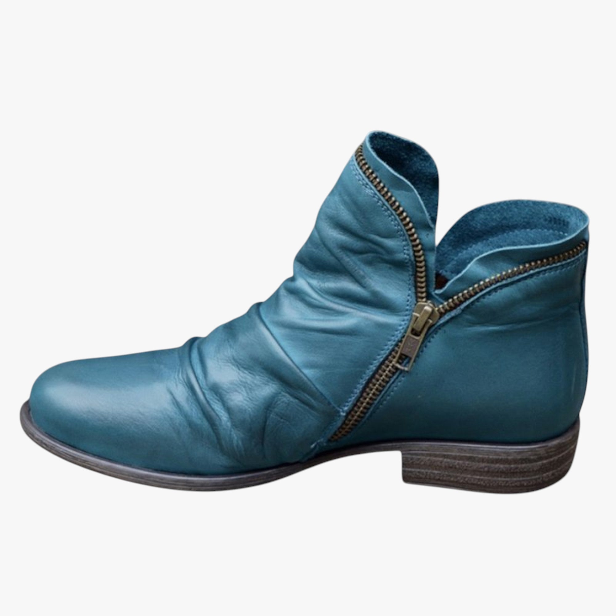 Blue leather ankle boot with a zipper on a white background