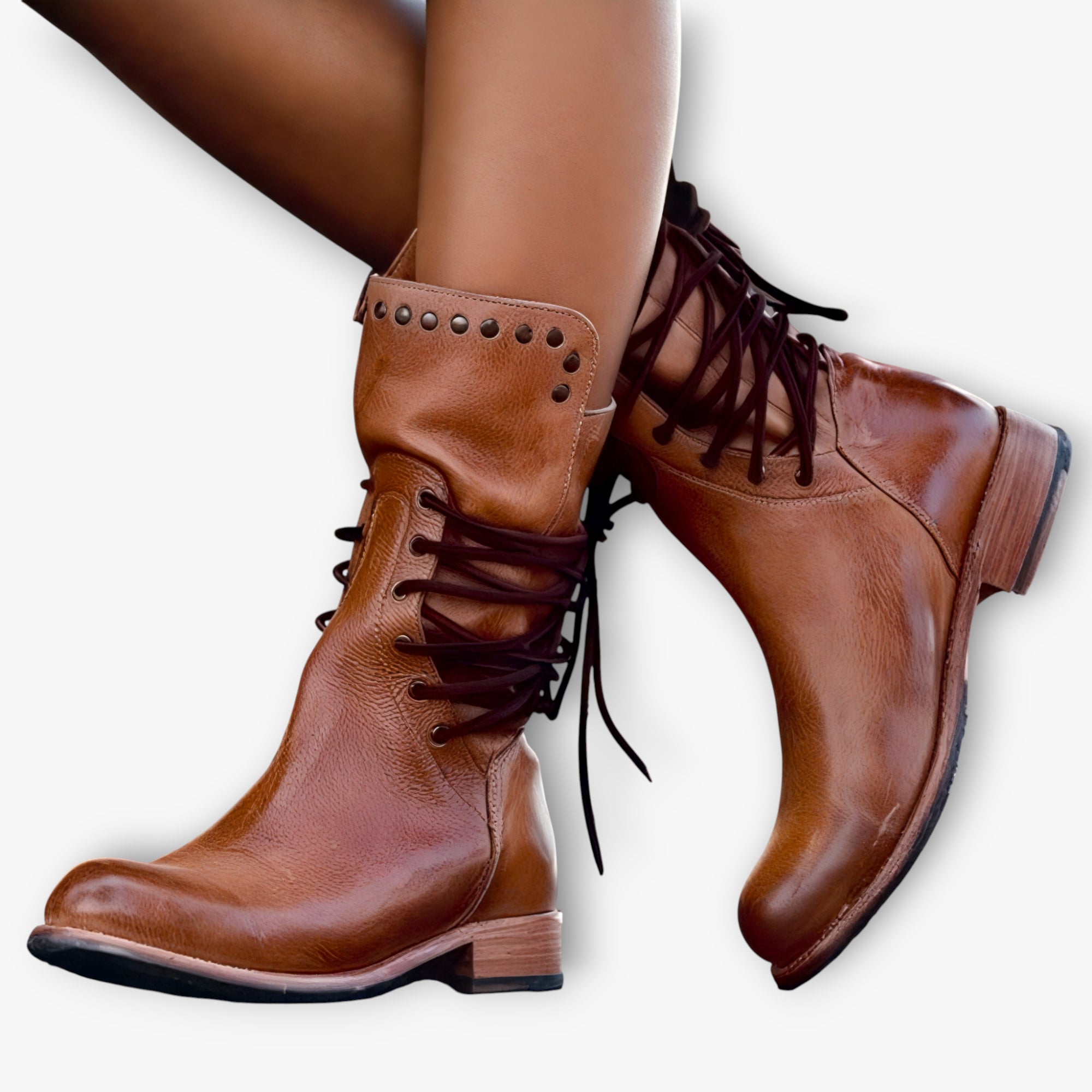 Brown leather boots with lace-up design on a white background