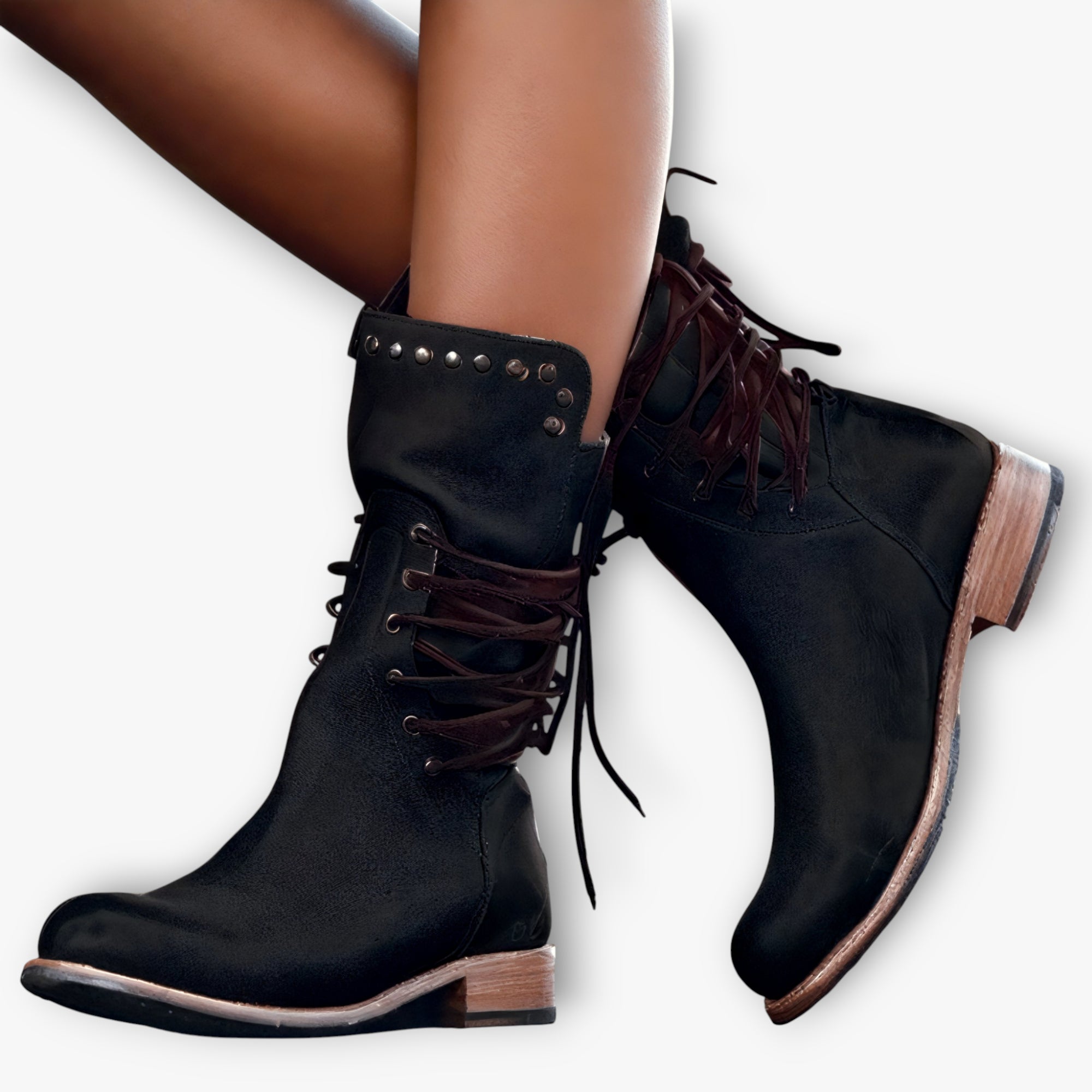 Black suede boots with brown laces on a white background