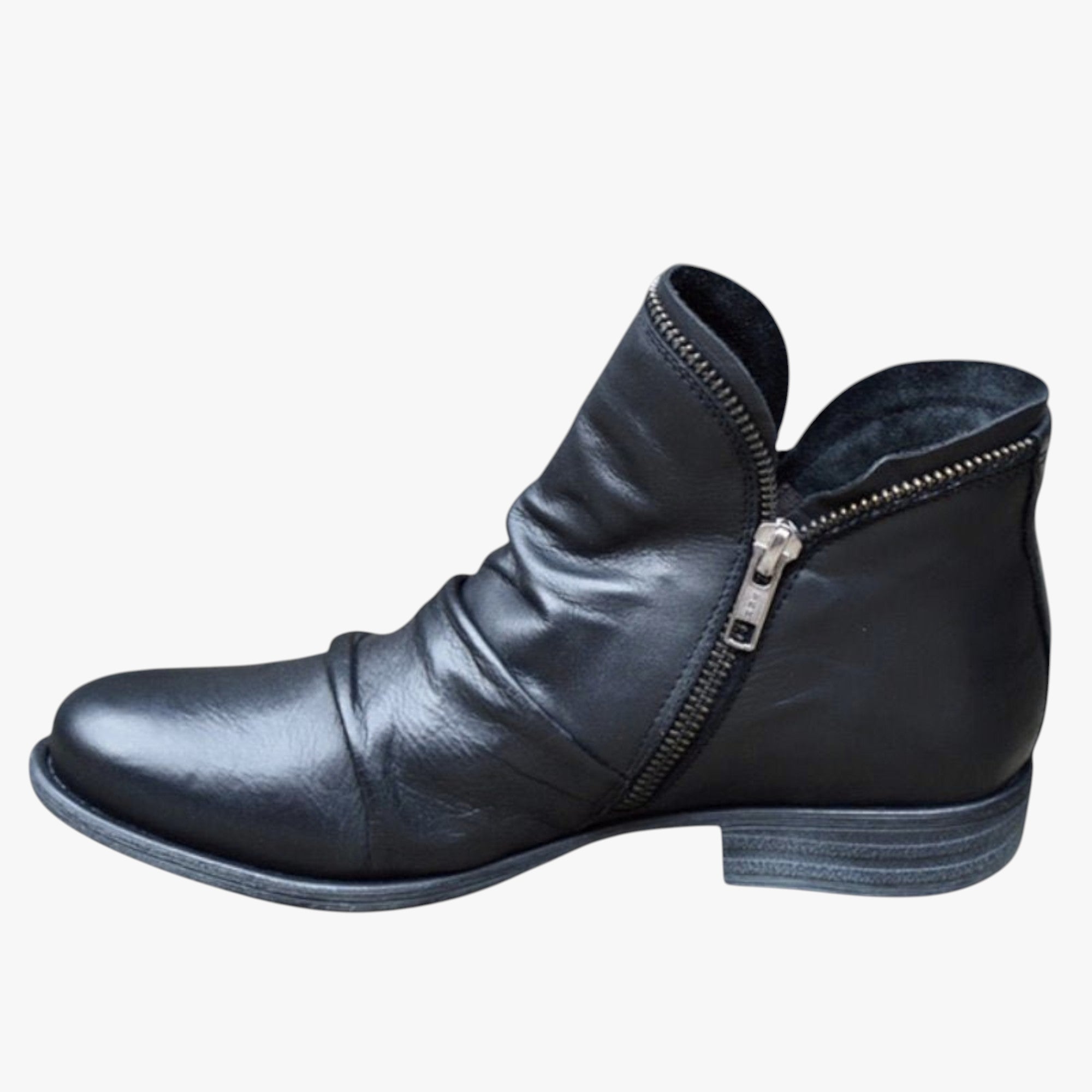 Black leather ankle boot with a zipper on a white background