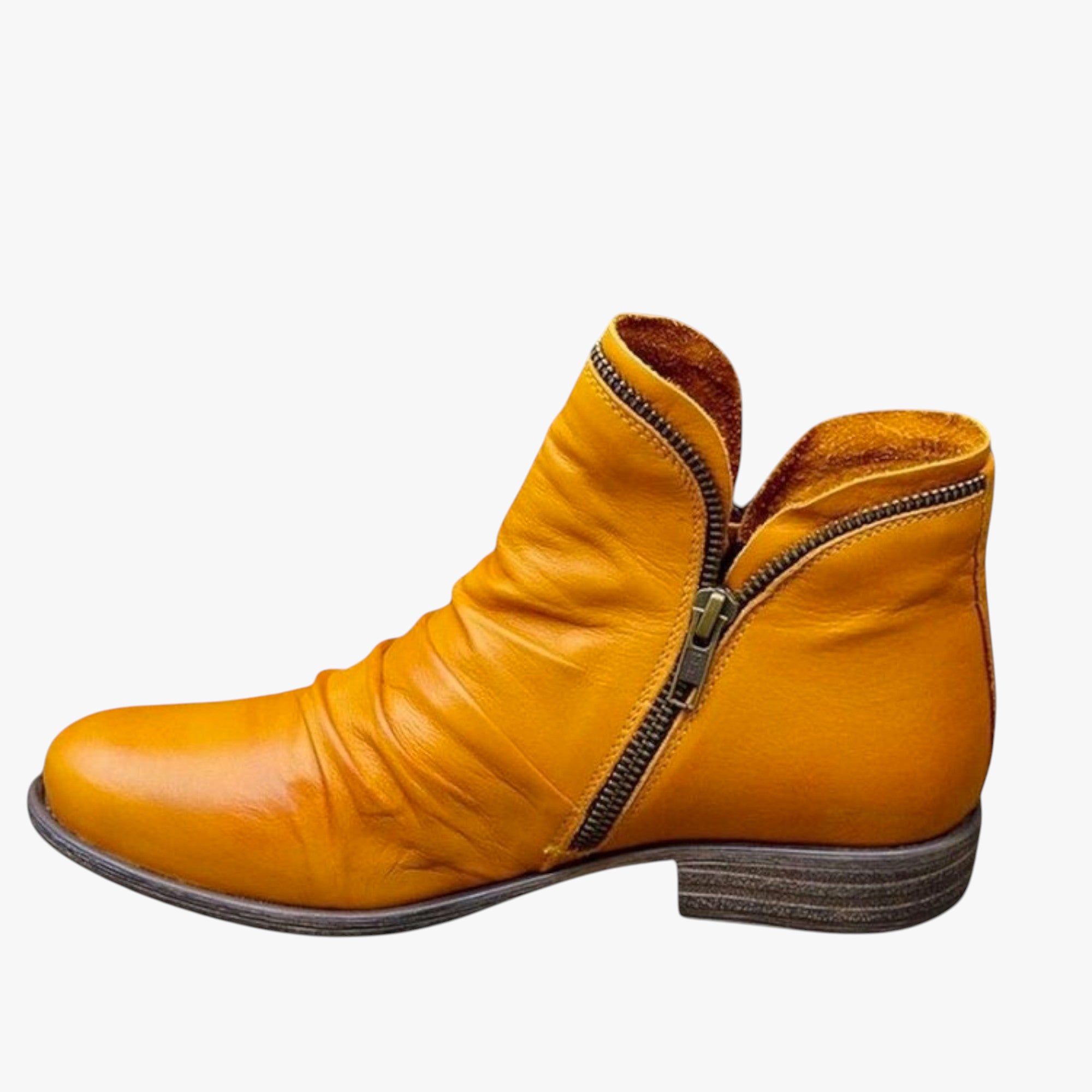 Yellow ankle boot with a zipper on a white background
