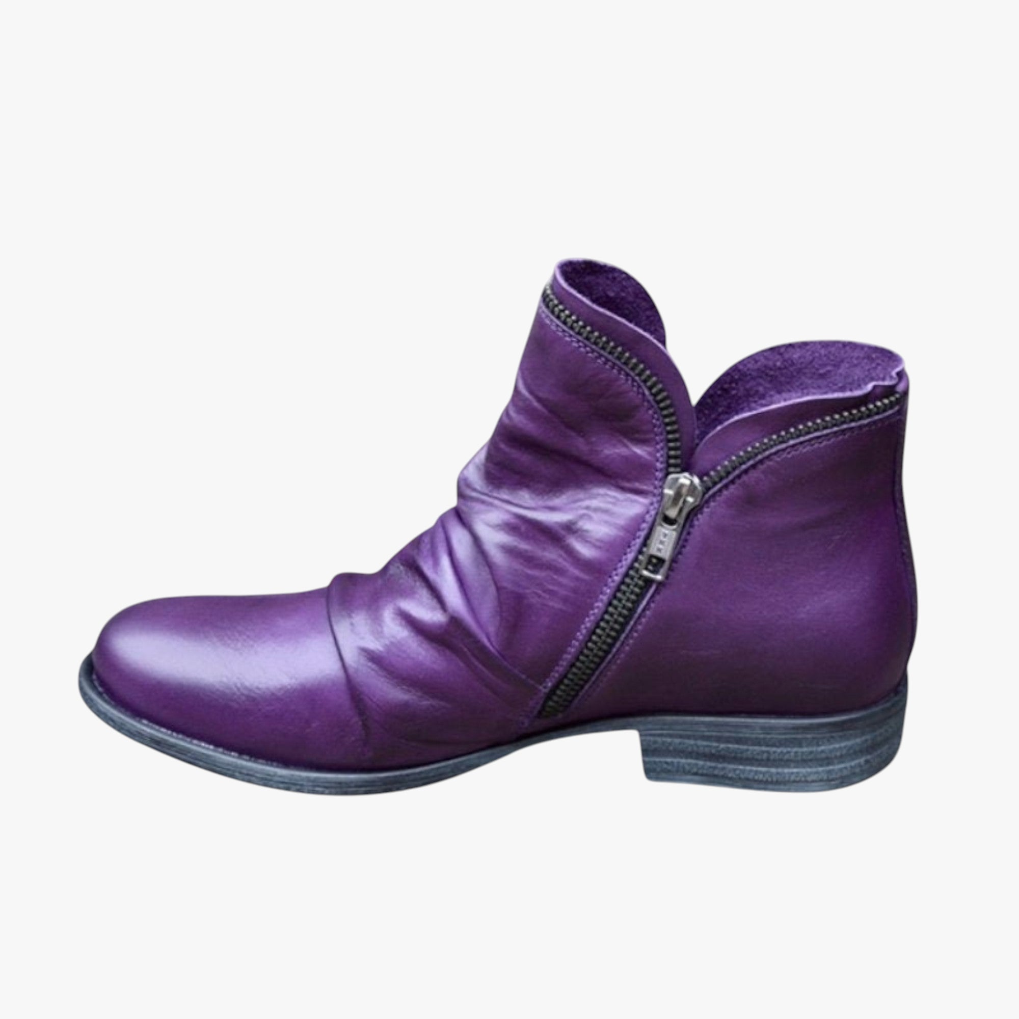 Purple ankle boot with a zipper on a white background