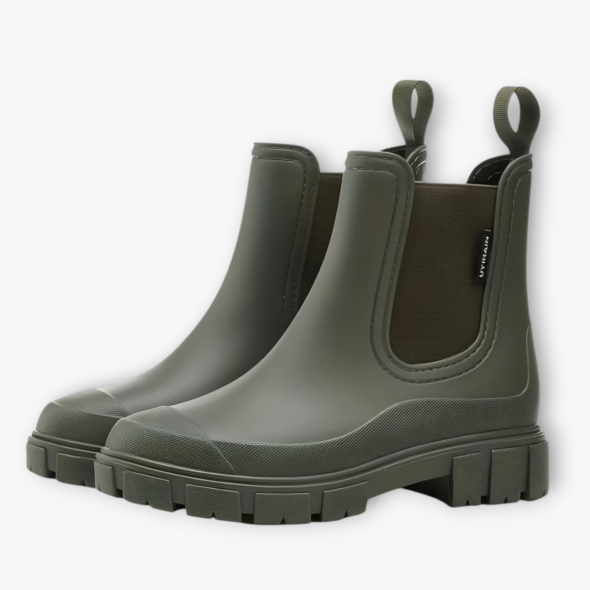 Pair of green rubber boots on a white background