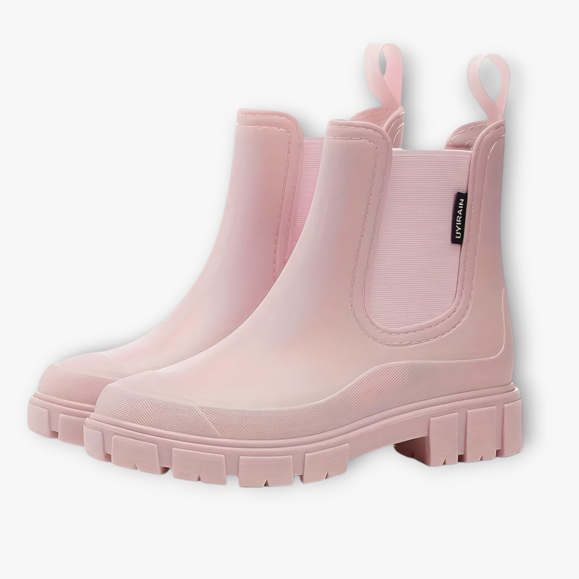 Pair of pink rain boots on a white background