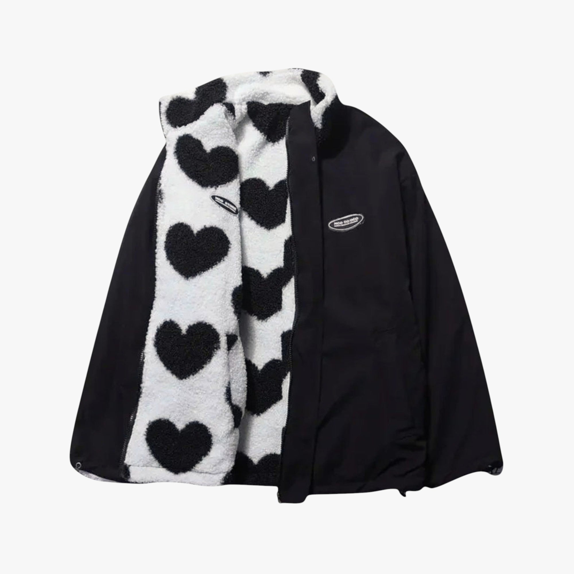 Black jacket with a white scarf featuring black heart patterns on a white background